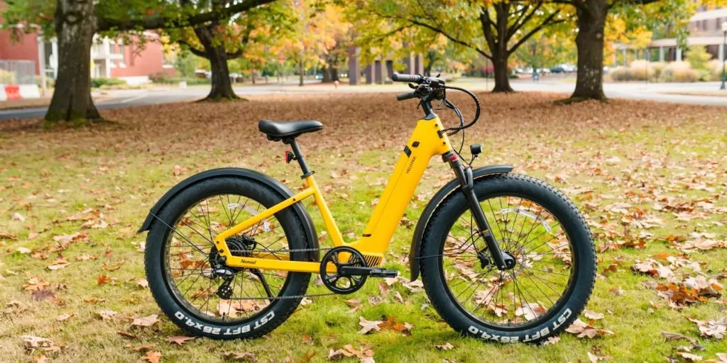 A Sunny Yellow Bicycle Standing In A Peaceful Natural Landscape