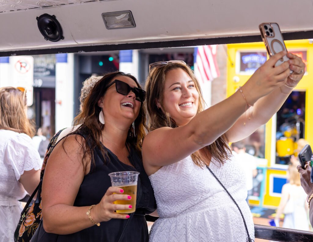 ladies taking selfie on party bus